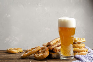 beer and pretzels on table